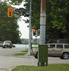 crosswalk sign with pumpkin instead of hand signal
