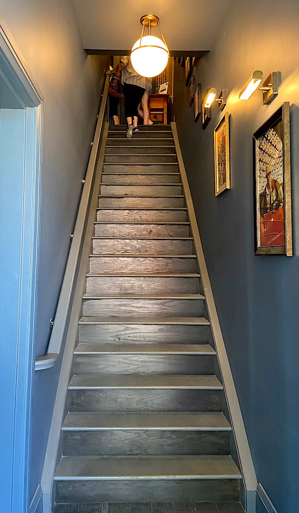 twenty stairs to second floor river bookshop in amherstburg, ontario a barrier to persons with disabilities.