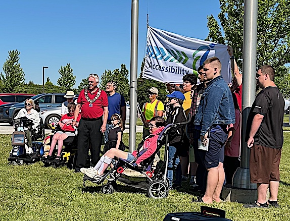small crowd gathered for National AccessAbility Week flag raising at Amherstburg park in 2026.